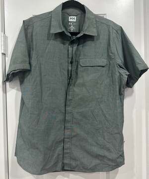 Helly Hansen short-sleeve, button-up shirt in a pale green or sage color.